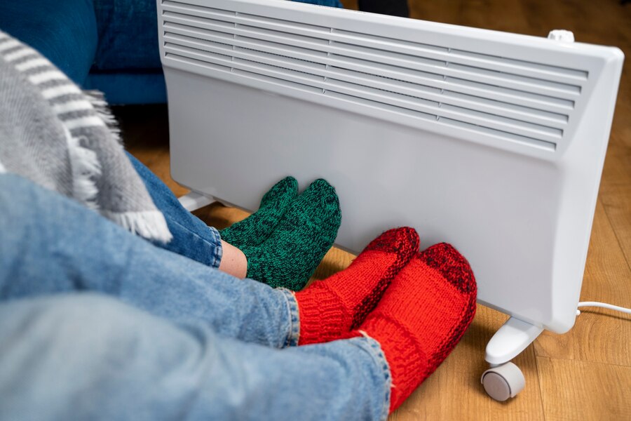 people with legs near a high Heat retention storage heaters