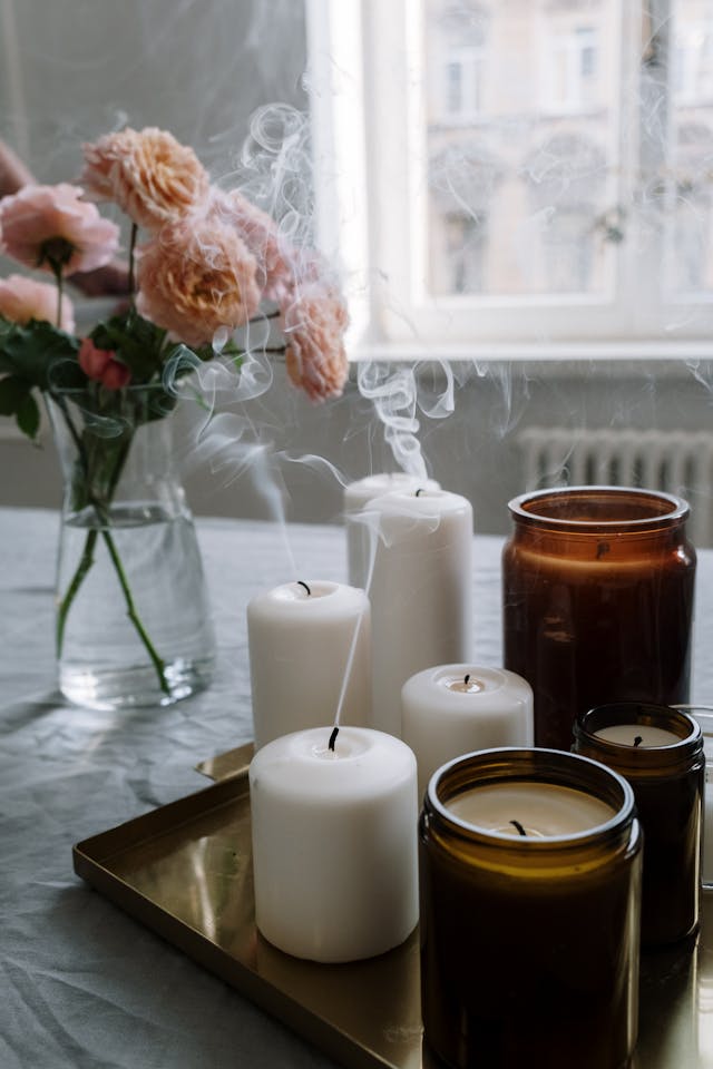 Candles and Jars on a table waiting to be properly disposed of