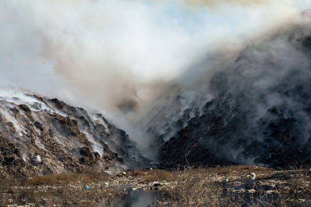 A pile of waste burning in a landfill site